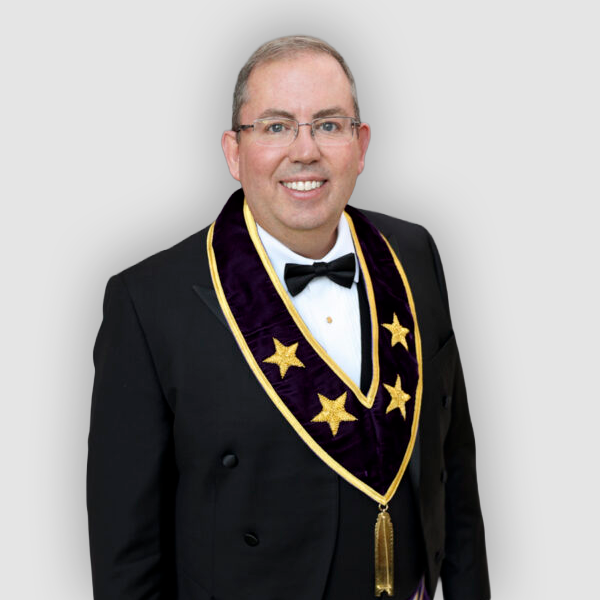 Smiling man in Grand Lodge officer's uniform